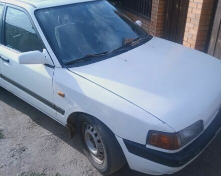 Білий Мазда 323, об'ємом двигуна 1 л та пробігом 320 тис. км за 1000 $, фото 1 на Automoto.ua