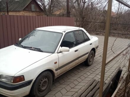 Білий Мазда 323, об'ємом двигуна 1 л та пробігом 335 тис. км за 1200 $, фото 1 на Automoto.ua
