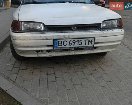 Белый Мазда 323, объемом двигателя 1.7 л и пробегом 250 тыс. км за 1000 $, фото 1 на Automoto.ua