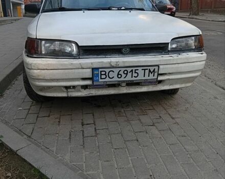 Белый Мазда 323, объемом двигателя 1.7 л и пробегом 250 тыс. км за 900 $, фото 1 на Automoto.ua