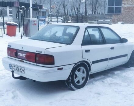 Белый Мазда 323, объемом двигателя 1.8 л и пробегом 200 тыс. км за 700 $, фото 1 на Automoto.ua