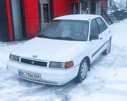 Белый Мазда 323, объемом двигателя 1.8 л и пробегом 250 тыс. км за 650 $, фото 1 на Automoto.ua
