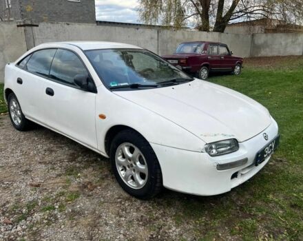 Белый Мазда 323, объемом двигателя 1.5 л и пробегом 130 тыс. км за 1800 $, фото 1 на Automoto.ua