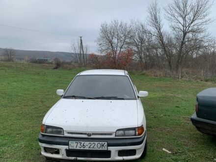 Белый Мазда 323, объемом двигателя 1.7 л и пробегом 300 тыс. км за 850 $, фото 1 на Automoto.ua