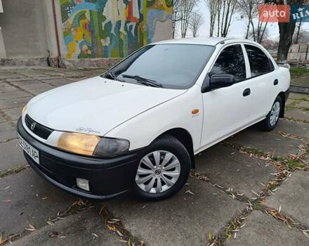 Белый Мазда 323, объемом двигателя 1.5 л и пробегом 431 тыс. км за 2699 $, фото 1 на Automoto.ua