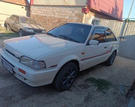 Белый Мазда 323, объемом двигателя 1.6 л и пробегом 200 тыс. км за 1350 $, фото 1 на Automoto.ua