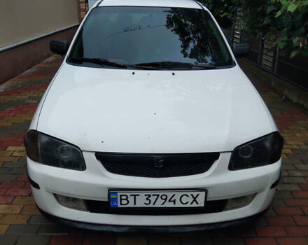 Белый Мазда 323, объемом двигателя 1.5 л и пробегом 250 тыс. км за 2500 $, фото 1 на Automoto.ua