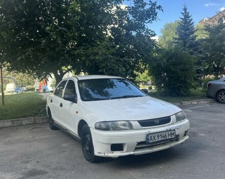 Белый Мазда 323, объемом двигателя 1.5 л и пробегом 235 тыс. км за 1404 $, фото 1 на Automoto.ua