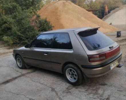 Бежевый Мазда 323, объемом двигателя 1.3 л и пробегом 323 тыс. км за 1500 $, фото 1 на Automoto.ua