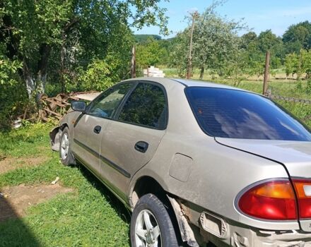 Бежевый Мазда 323, объемом двигателя 1.5 л и пробегом 280 тыс. км за 890 $, фото 5 на Automoto.ua