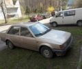 Бежевый Мазда 323, объемом двигателя 1.3 л и пробегом 300 тыс. км за 750 $, фото 1 на Automoto.ua