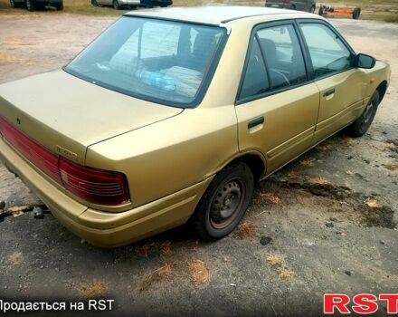 Бежевий Мазда 323, об'ємом двигуна 1.5 л та пробігом 500 тис. км за 740 $, фото 1 на Automoto.ua
