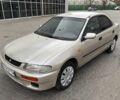 Бежевый Мазда 323, объемом двигателя 1.5 л и пробегом 220 тыс. км за 1500 $, фото 1 на Automoto.ua
