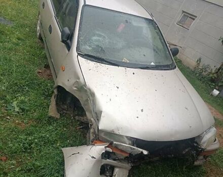 Бежевый Мазда 323, объемом двигателя 1.49 л и пробегом 280 тыс. км за 890 $, фото 1 на Automoto.ua