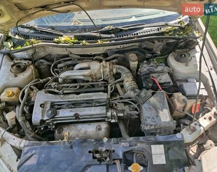 Бежевый Мазда 323, объемом двигателя 1.49 л и пробегом 280 тыс. км за 890 $, фото 6 на Automoto.ua