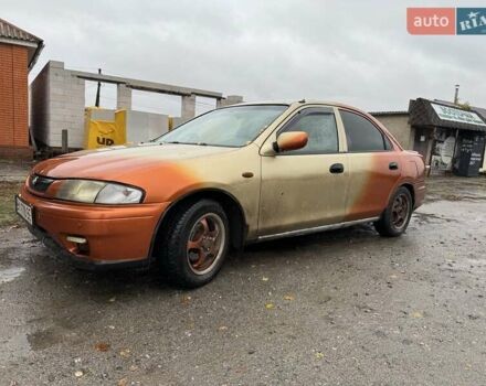 Бежевий Мазда 323, об'ємом двигуна 1.5 л та пробігом 300 тис. км за 1500 $, фото 1 на Automoto.ua