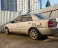 Бежевый Мазда 323, объемом двигателя 2 л и пробегом 300 тыс. км за 447 $, фото 1 на Automoto.ua