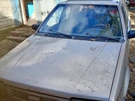 Бежевий Мазда 323, об'ємом двигуна 1.3 л та пробігом 10 тис. км за 239 $, фото 1 на Automoto.ua