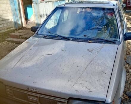 Бежевый Мазда 323, объемом двигателя 1.3 л и пробегом 10 тыс. км за 239 $, фото 1 на Automoto.ua