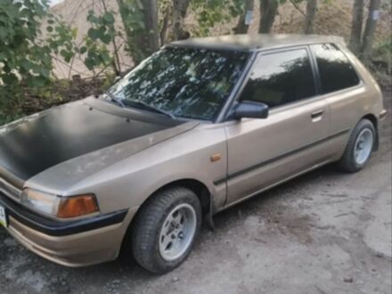 Бежевый Мазда 323, объемом двигателя 1.3 л и пробегом 323 тыс. км за 1500 $, фото 1 на Automoto.ua