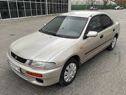 Бежевий Мазда 323, об'ємом двигуна 1.5 л та пробігом 220 тис. км за 1500 $, фото 1 на Automoto.ua