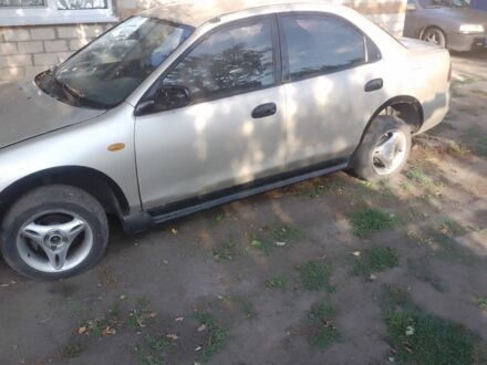 Бежевый Мазда 323, объемом двигателя 0 л и пробегом 250 тыс. км за 1350 $, фото 1 на Automoto.ua