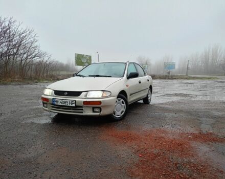 Бежевый Мазда 323, объемом двигателя 1.8 л и пробегом 150 тыс. км за 1600 $, фото 1 на Automoto.ua