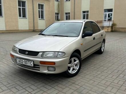 Бежевый Мазда 323, объемом двигателя 1.5 л и пробегом 280 тыс. км за 890 $, фото 1 на Automoto.ua