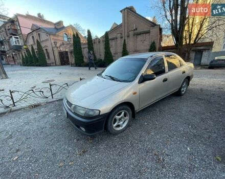 Бежевий Мазда 323, об'ємом двигуна 1.5 л та пробігом 324 тис. км за 2150 $, фото 1 на Automoto.ua
