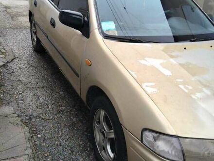 Бежевый Мазда 323, объемом двигателя 1.5 л и пробегом 334 тыс. км за 1200 $, фото 1 на Automoto.ua