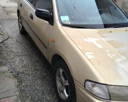 Бежевый Мазда 323, объемом двигателя 1.5 л и пробегом 334 тыс. км за 1200 $, фото 1 на Automoto.ua