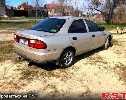 Бежевый Мазда 323, объемом двигателя 1.5 л и пробегом 0 тыс. км за 2500 $, фото 1 на Automoto.ua