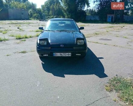Чорний Мазда 323, об'ємом двигуна 1.84 л та пробігом 320 тис. км за 1900 $, фото 4 на Automoto.ua