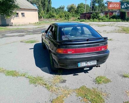 Чорний Мазда 323, об'ємом двигуна 1.84 л та пробігом 320 тис. км за 1900 $, фото 2 на Automoto.ua