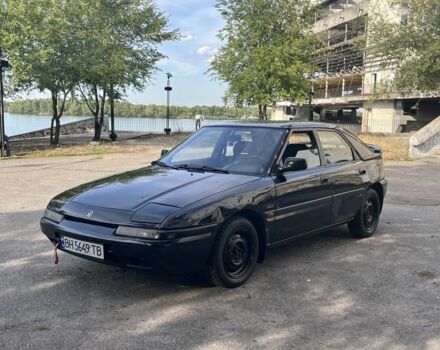Чорний Мазда 323, об'ємом двигуна 1.9 л та пробігом 200 тис. км за 1750 $, фото 1 на Automoto.ua