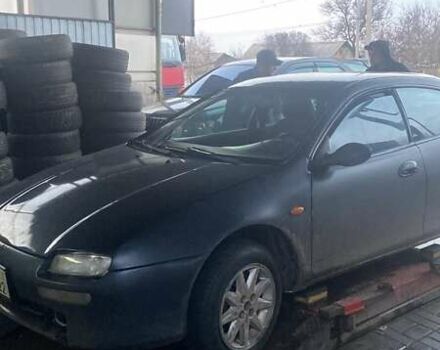 Черный Мазда 323, объемом двигателя 1.5 л и пробегом 230 тыс. км за 2300 $, фото 1 на Automoto.ua