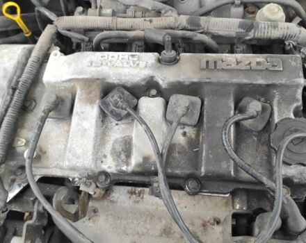 Черный Мазда 323, объемом двигателя 2 л и пробегом 260 тыс. км за 700 $, фото 4 на Automoto.ua