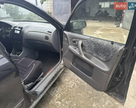 Мазда 323 1999 в Тульчине на Automoto.ua Черный Мазда 323, объемом двигателя 1.5 л и пробегом 247 тыс. км за 2150 $, фото 9 на Automoto.ua