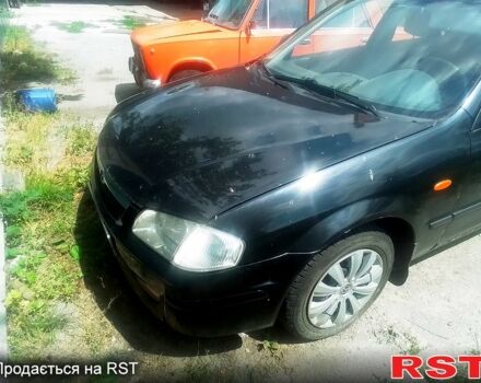 Чорний Мазда 323, об'ємом двигуна 1.5 л та пробігом 0 тис. км за 2100 $, фото 7 на Automoto.ua