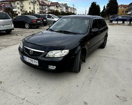 Черный Мазда 323, объемом двигателя 2 л и пробегом 286 тыс. км за 3200 $, фото 1 на Automoto.ua