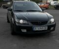 Чорний Мазда 323, об'ємом двигуна 2 л та пробігом 300 тис. км за 1850 $, фото 1 на Automoto.ua