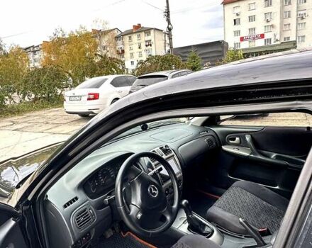 Черный Мазда 323, объемом двигателя 2 л и пробегом 286 тыс. км за 3200 $, фото 5 на Automoto.ua