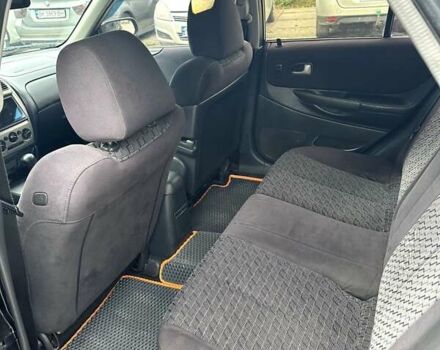 Черный Мазда 323, объемом двигателя 2 л и пробегом 286 тыс. км за 3200 $, фото 6 на Automoto.ua