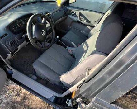 Черный Мазда 323, объемом двигателя 1.6 л и пробегом 250 тыс. км за 2500 $, фото 7 на Automoto.ua