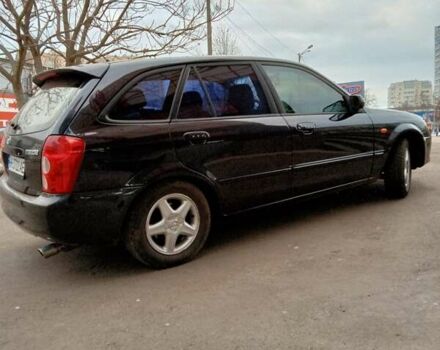 Черный Мазда 323, объемом двигателя 1.6 л и пробегом 305 тыс. км за 3800 $, фото 5 на Automoto.ua