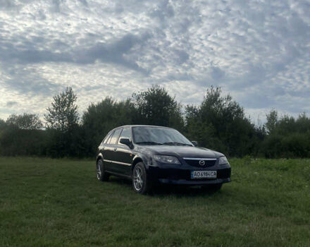 Черный Мазда 323, объемом двигателя 2 л и пробегом 320 тыс. км за 2700 $, фото 1 на Automoto.ua