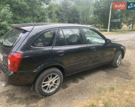 Черный Мазда 323, объемом двигателя 2 л и пробегом 320 тыс. км за 2700 $, фото 4 на Automoto.ua