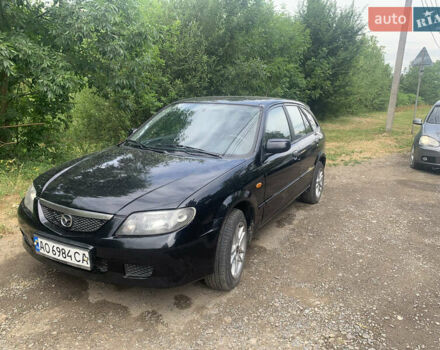 Черный Мазда 323, объемом двигателя 2 л и пробегом 320 тыс. км за 2700 $, фото 5 на Automoto.ua