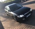 Черный Мазда 323, объемом двигателя 2 л и пробегом 333 тыс. км за 914 $, фото 1 на Automoto.ua
