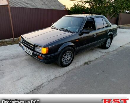 Черный Мазда 323, объемом двигателя 1.6 л и пробегом 300 тыс. км за 750 $, фото 1 на Automoto.ua